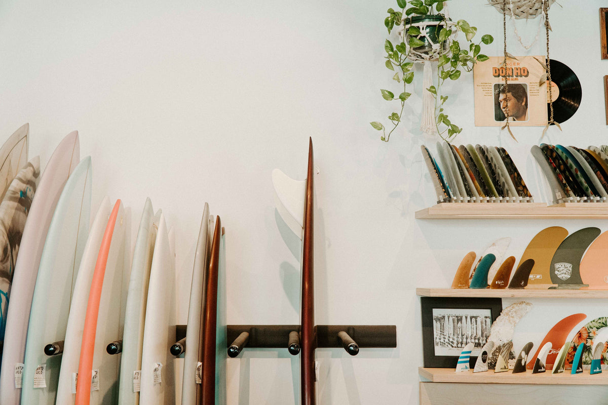 Surf shop showing its display of surfboards and surf fins 